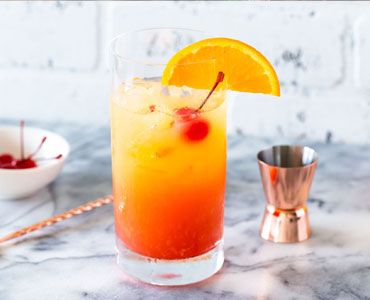 Tequila Sunrise - Tequila, Orange juice, and Grenadine syrup.